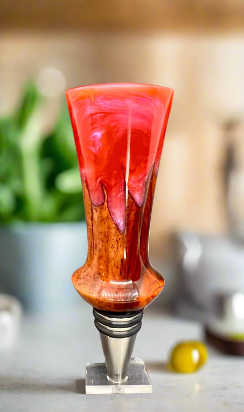 Hand turned Bottle Stopper.
Cocobolo wood. Magenta and pink color resin.
Stainless steel stopper.